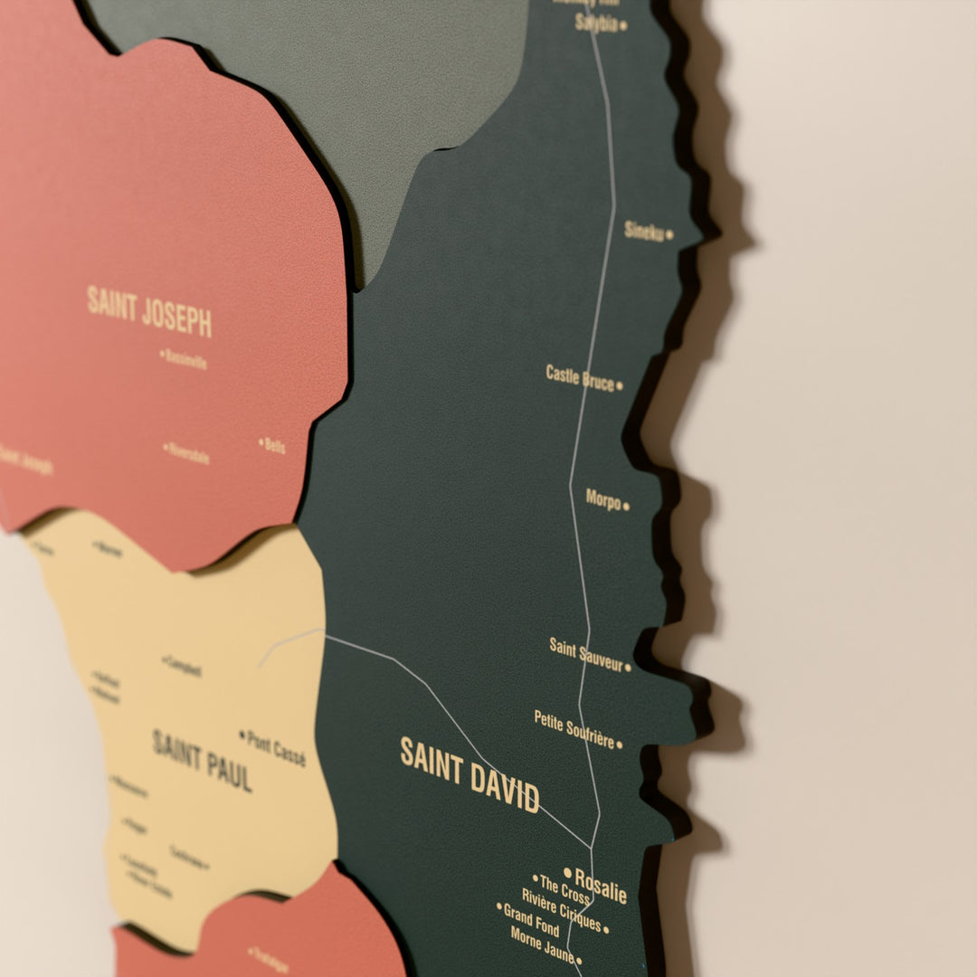 Close-up of the Sage Dominica wooden wall map with layered regions and printed names