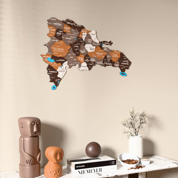 Soil Dominican Republic wooden wall map on a beige wall above a console with figurines