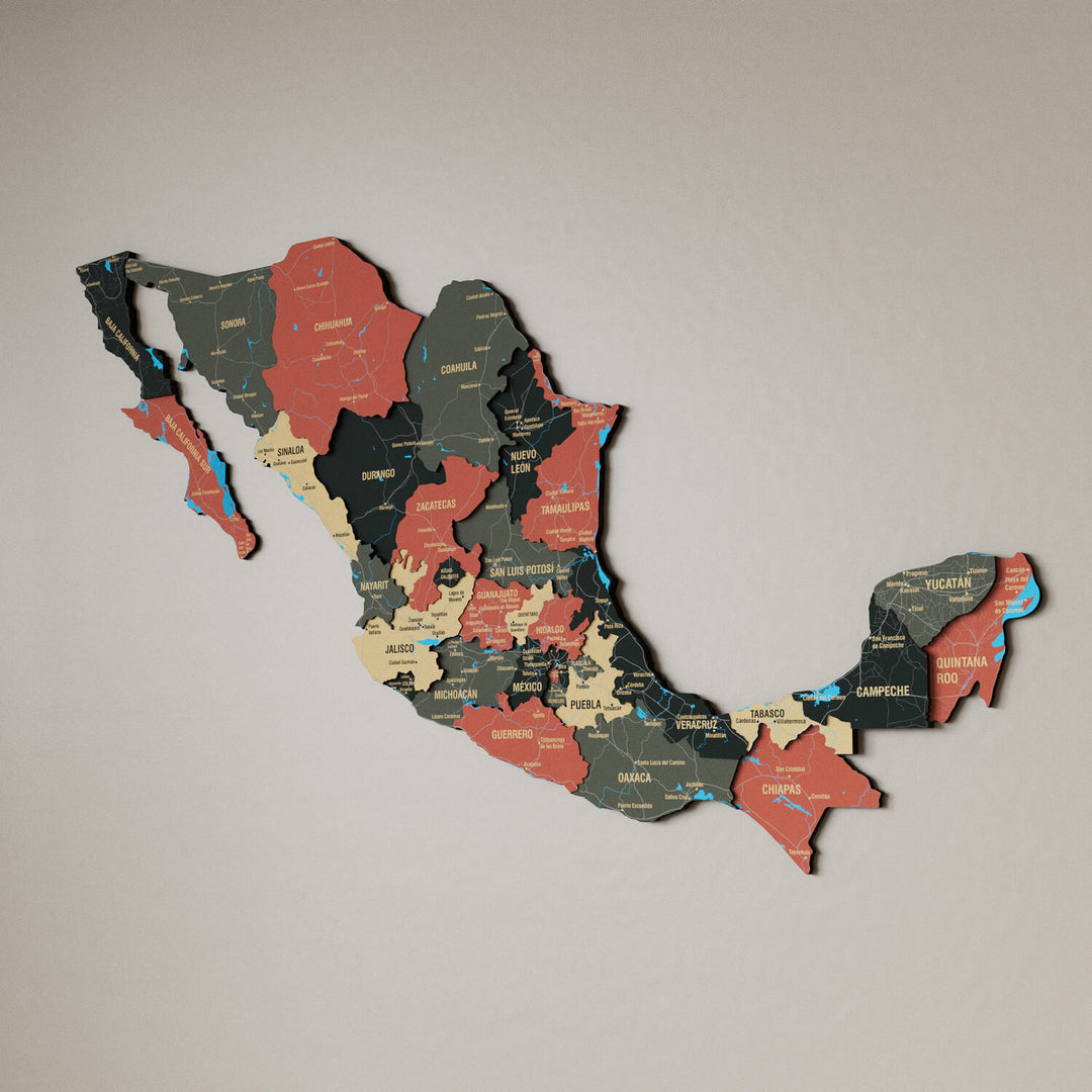 Sage Mexico wooden wall map in dark green, tan and salmon states on a beige wall, angled view showing the layered pieces