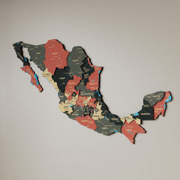 Sage Mexico wooden wall map in dark green, tan and salmon states on a beige wall, angled view showing the layered pieces