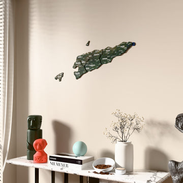 Satellite East Timor wooden wall map beside a sheer curtain, angled view