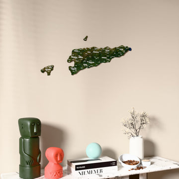 Satellite East Timor wooden wall map on a beige wall above a console with figurines