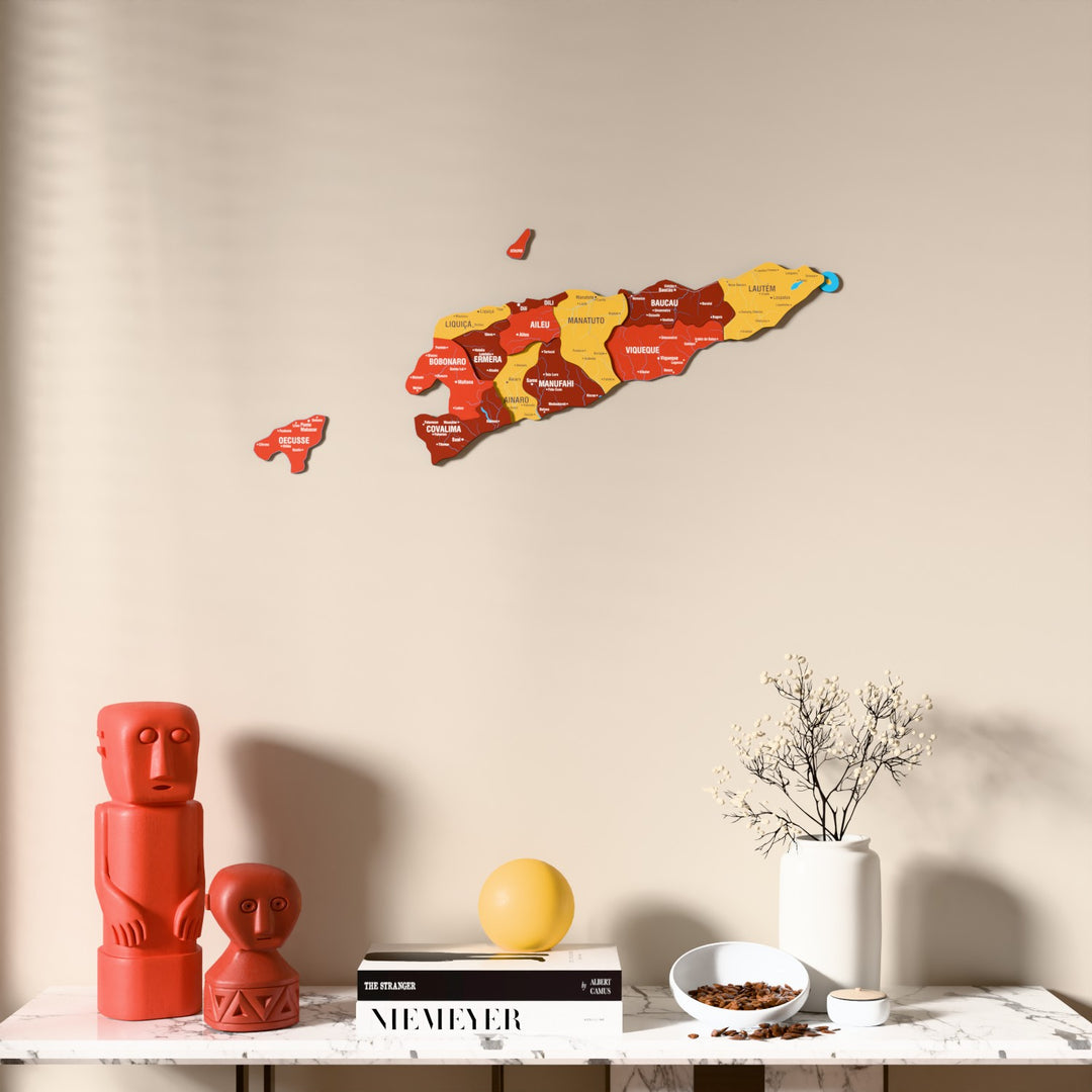 Flag colored East Timor wooden wall map above a marble console, front view