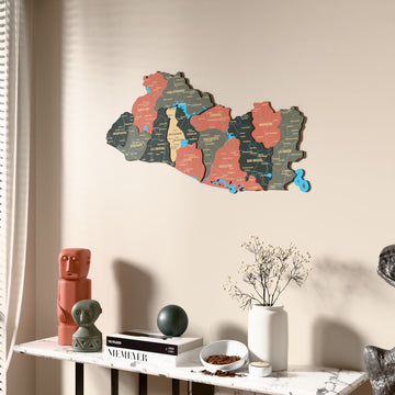 Sage El Salvador wooden wall map beside a sheer curtain, angled view