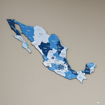 Navy Mexico wooden wall map in shades of blue on a beige wall, angled view showing the layered pieces
