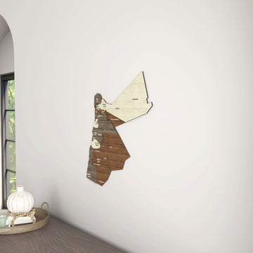 Jordan wooden wall map on a white wall beside an arched window, with a vase below