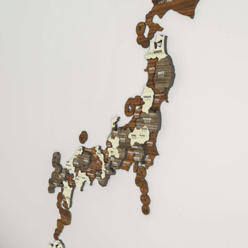Angled close view of the layered wooden Japan map showing Honshu prefectures from Aomori to Kyushu