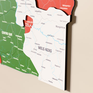 Close-up of the Flag colored Equatorial Guinea wooden wall map with layered regions and printed names