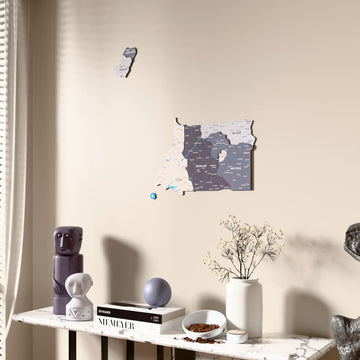 Nimbus Equatorial Guinea wooden wall map beside a sheer curtain, angled view
