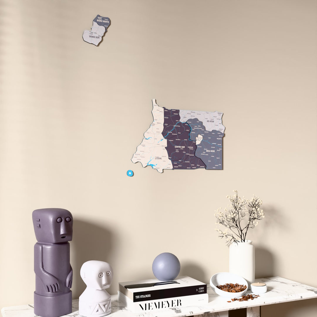 Nimbus Equatorial Guinea wooden wall map on a beige wall above a console with figurines