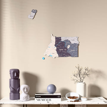 Nimbus Equatorial Guinea wooden wall map above a marble console, front view