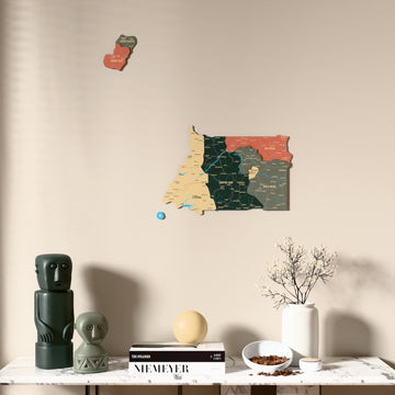 Sage Equatorial Guinea wooden wall map above a marble console, front view