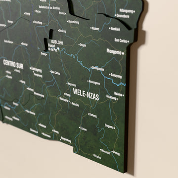 Close-up of the Satellite Equatorial Guinea wooden wall map with layered regions and printed names