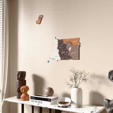 Soil Equatorial Guinea wooden wall map beside a sheer curtain, angled view
