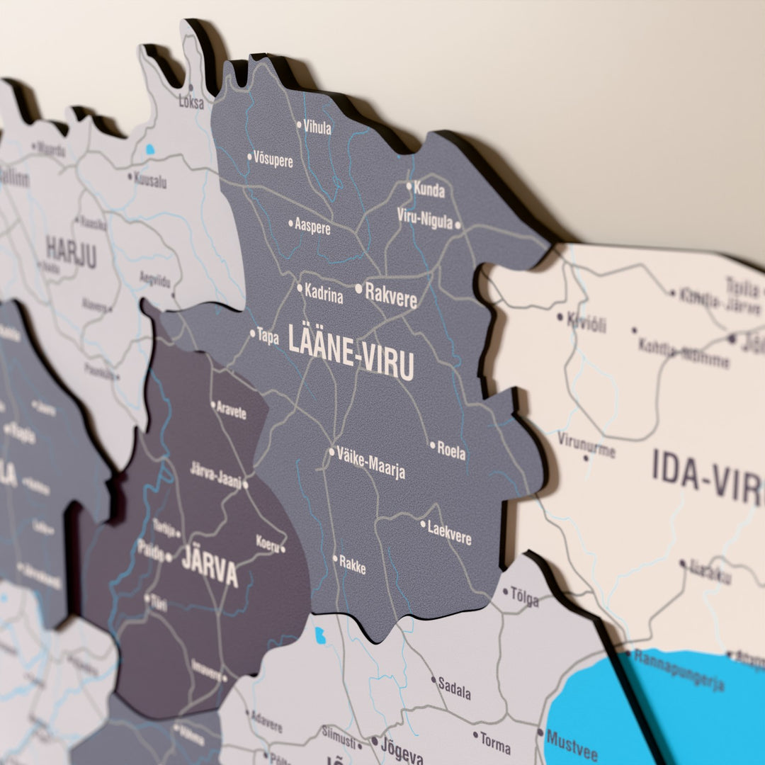 Close-up of the Nimbus Estonia wooden wall map with layered regions and printed names