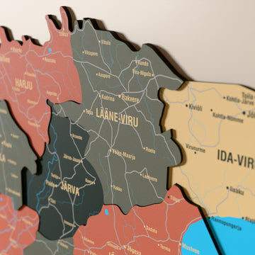 Close-up of the Sage Estonia wooden wall map with layered regions and printed names