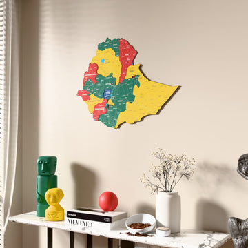 Flag colored Ethiopia wooden wall map beside a sheer curtain, angled view