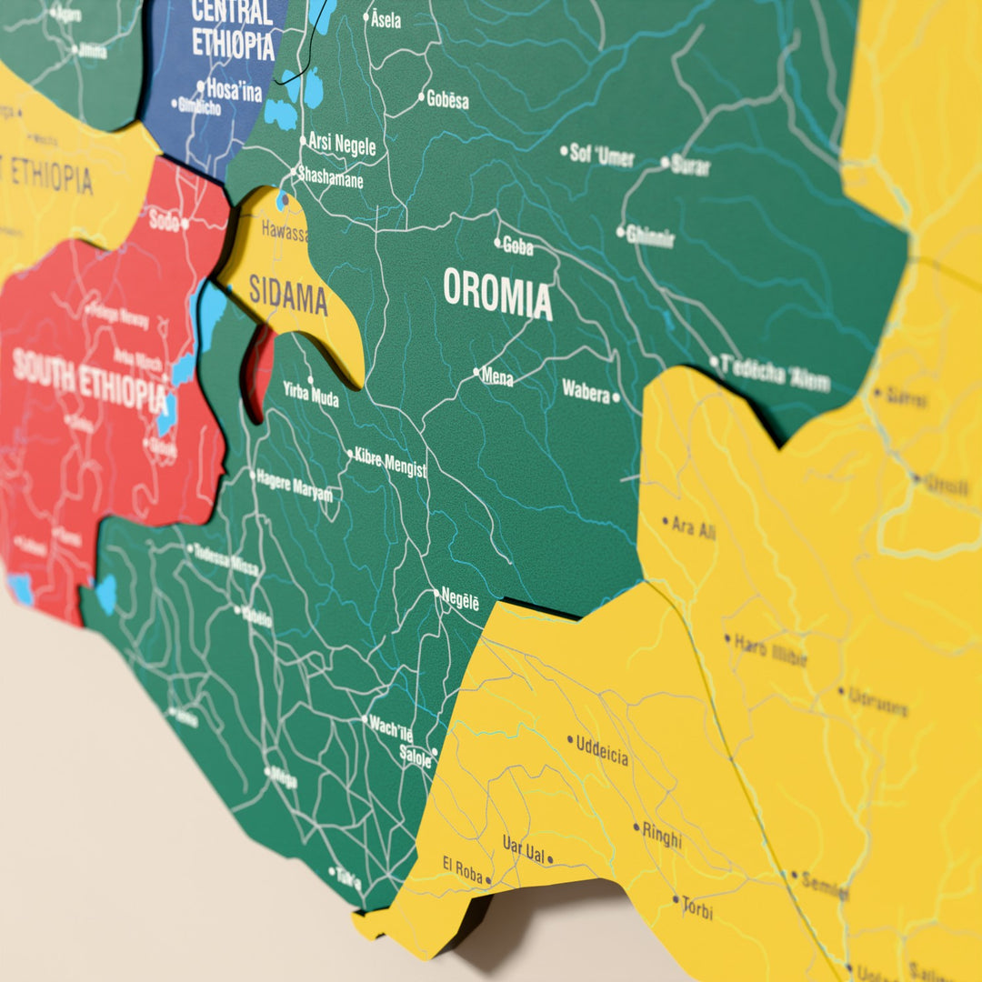 Close-up of the Flag colored Ethiopia wooden wall map with layered regions and printed names