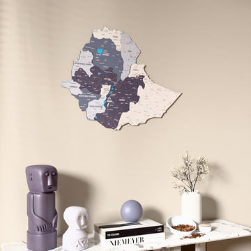 Nimbus Ethiopia wooden wall map on a beige wall above a console with figurines