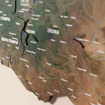 Close-up of the Satellite Ethiopia wooden wall map with layered regions and printed names