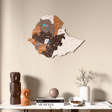 Soil Ethiopia wooden wall map above a marble console, front view
