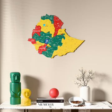 Flag colored Ethiopia wooden wall map above a marble console, front view