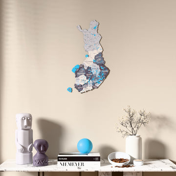 Nimbus Finland wooden wall map above a marble console, front view