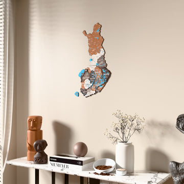 Soil Finland wooden wall map beside a sheer curtain, angled view