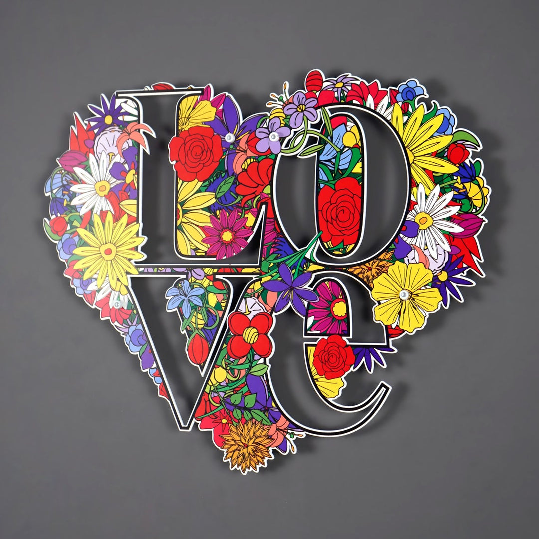 Floral heart-shaped LOVE metal wall art on a grey wall, large front view