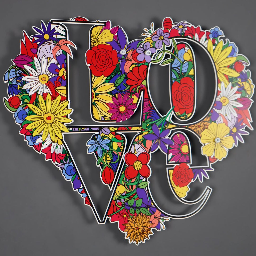 Close-up of the colourful flowers on the LOVE heart metal art