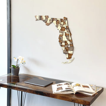 Multicolor wooden Florida map, side view above a resin-topped desk