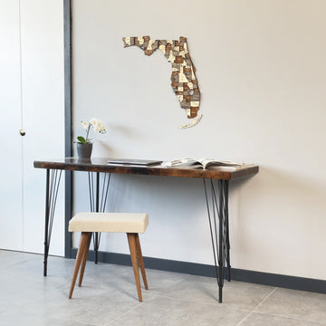 Multicolor wooden Florida wall map, wide view above a hairpin-leg desk