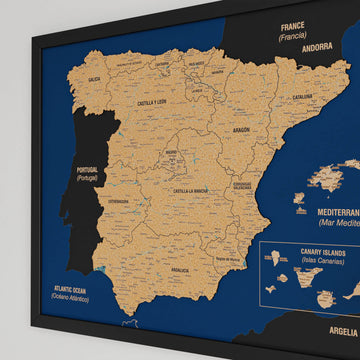 Large angled view of a black-framed Spain cork map with regions, Portugal in black and Canary Islands box