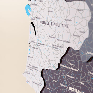 Close-up of the Nimbus France wooden wall map with layered regions and printed names