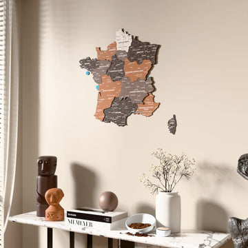 Soil France wooden wall map beside a sheer curtain, angled view
