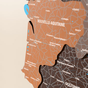 Close-up of the Soil France wooden wall map with layered regions and printed names