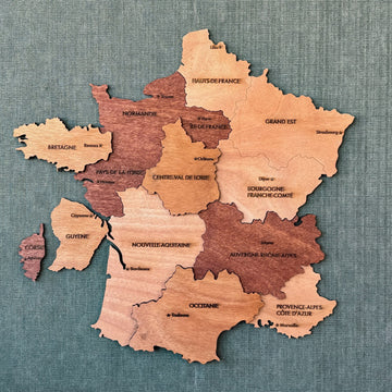 Wooden France wall map with region names in layered mahogany and light plywood, front view