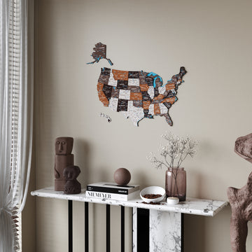 Soil colored United States wooden wall map beside a sheer curtain, above a marble console with decor