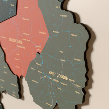 Close-up of the Sage Gabon wooden wall map with layered regions and printed names