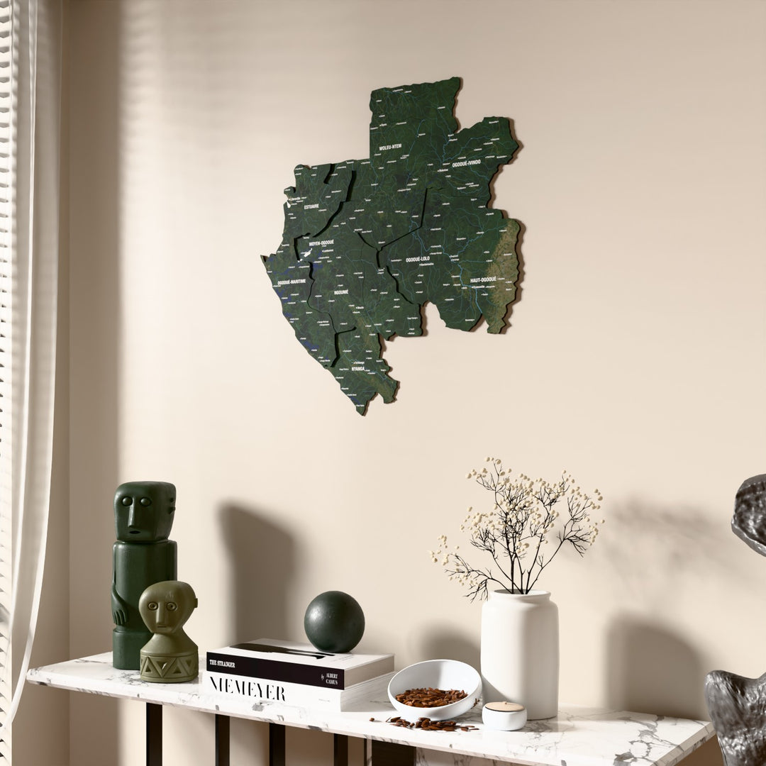 Satellite Gabon wooden wall map beside a sheer curtain, angled view