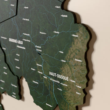 Close-up of the Satellite Gabon wooden wall map with layered regions and printed names