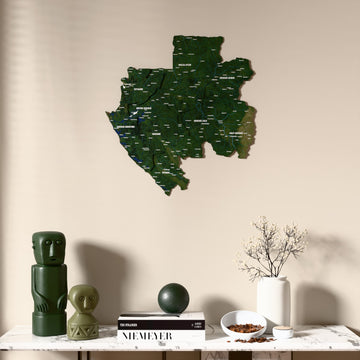 Satellite Gabon wooden wall map above a marble console, front view