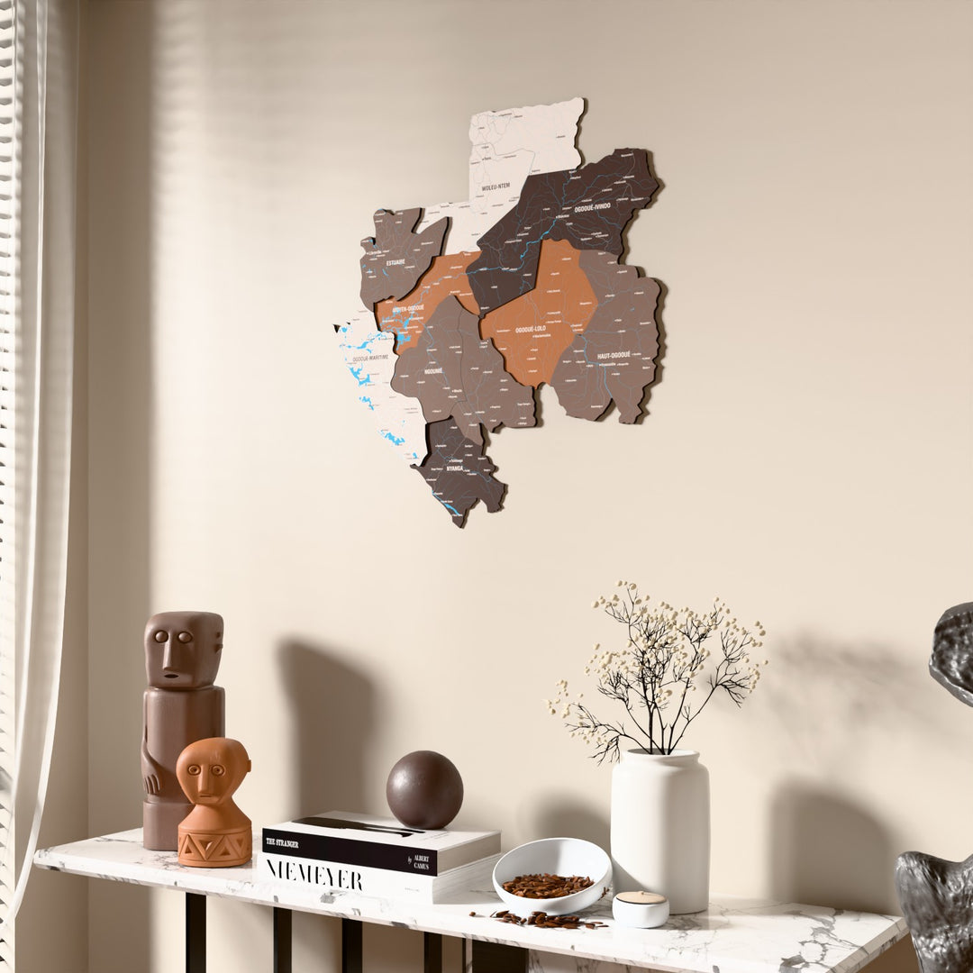 Soil Gabon wooden wall map beside a sheer curtain, angled view