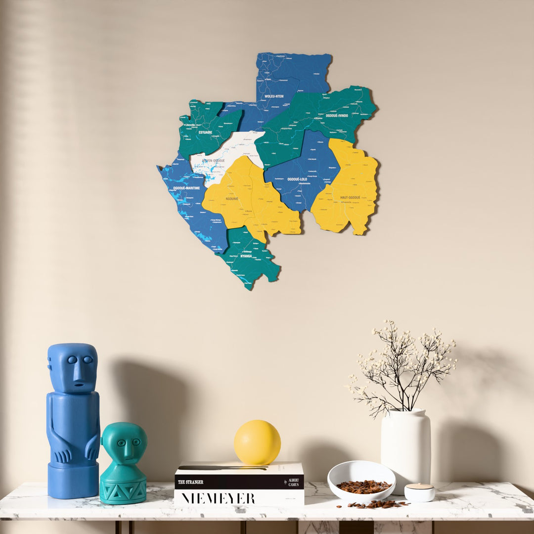 Flag colored Gabon wooden wall map above a marble console, front view
