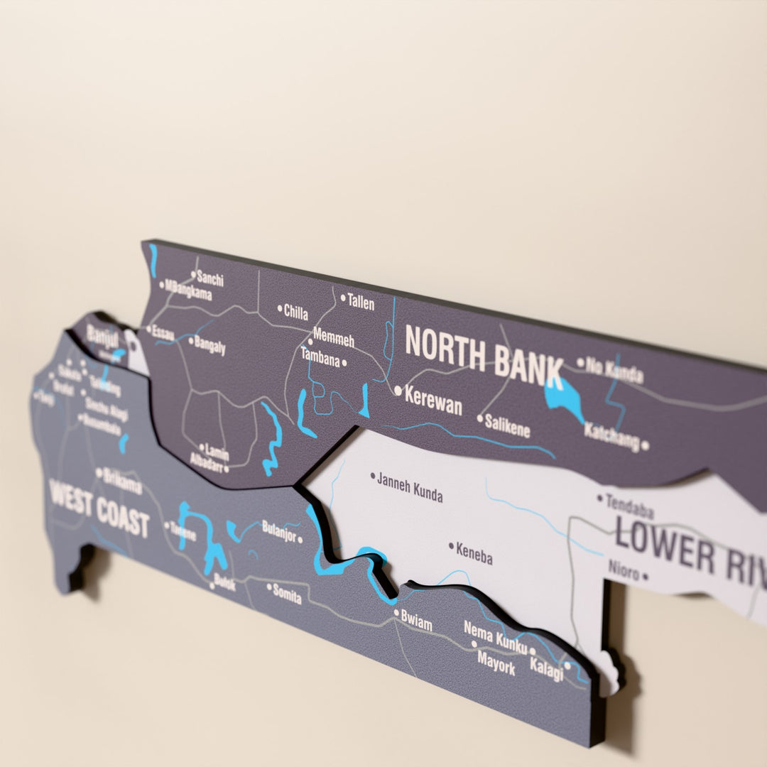 Close-up of the Nimbus Gambia wooden wall map with layered regions and printed names
