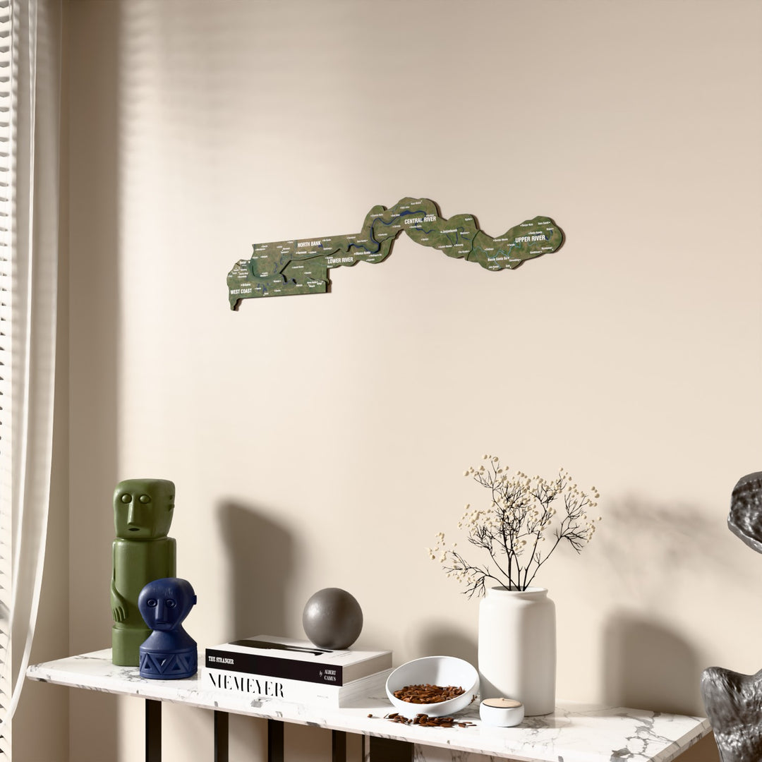 Satellite Gambia wooden wall map beside a sheer curtain, angled view