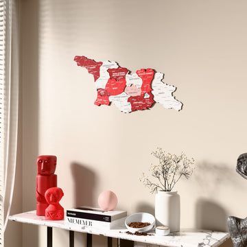 Flag colored Georgia wooden wall map beside a sheer curtain, angled view