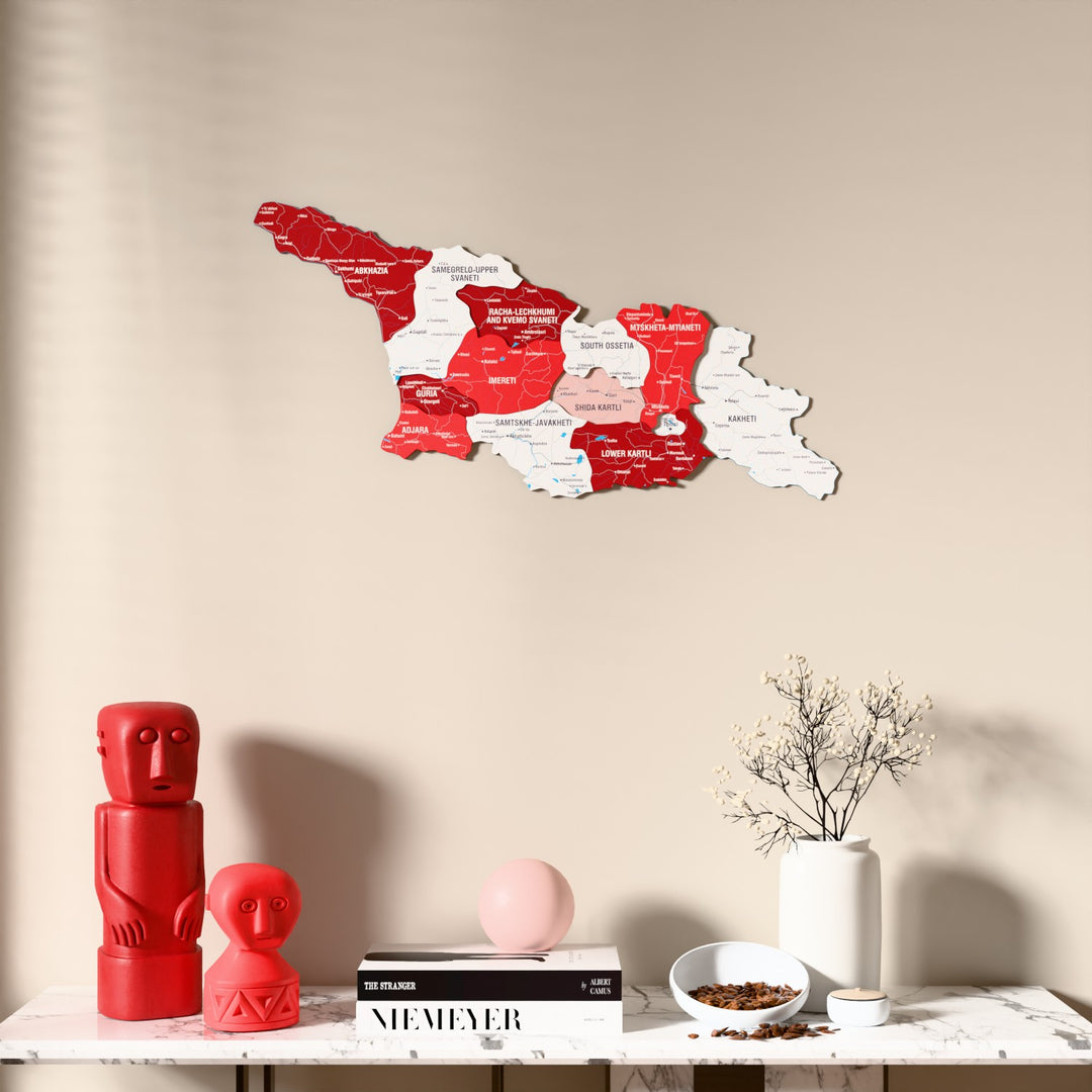 Flag colored Georgia wooden wall map above a marble console, front view