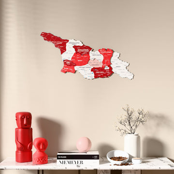Flag colored Georgia wooden wall map above a marble console, front view
