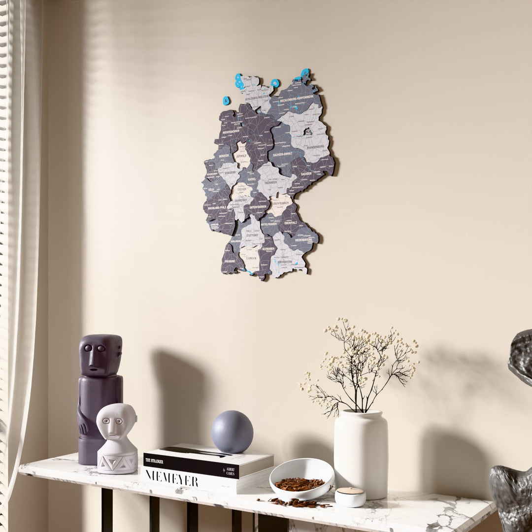 Nimbus Germany wooden wall map beside a sheer curtain, angled view